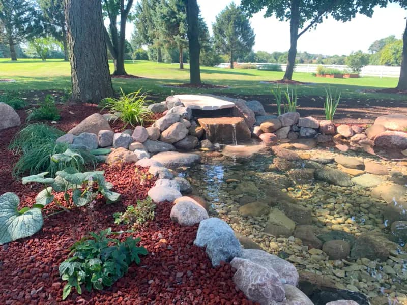 Custom stone water feature and pond built by Little Tree Nursery in Sullivan, WI